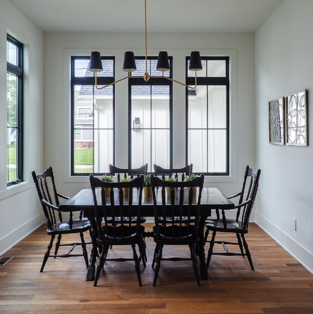 kitchen table with multiple windows surrounding the room